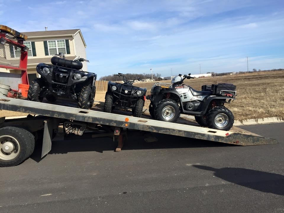 Area 47 Towing ATVs loaded on flatbed trailer